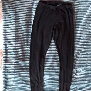 Selling children places leggings for 2 dollars.